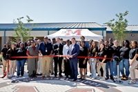 East Mississippi Community College President Dr. Scott Alsobrooks, center, cuts a ribbon to commemorate the completion of a project to construct new sidewalks, courtyards and seating areas on the college’s Golden Triangle campus. At the April 17 ribbon cutting, Alsobrooks is flanked, at left, by MDOT Public Information Officer David Kenney and EMCC Board of Trustees member Hazel Johnson. To the immediate right of Alsobrooks are EMCC Board of Trustees member Evelyn Murray and Lowndes County Board of Supervisors President Trip Hairston. 